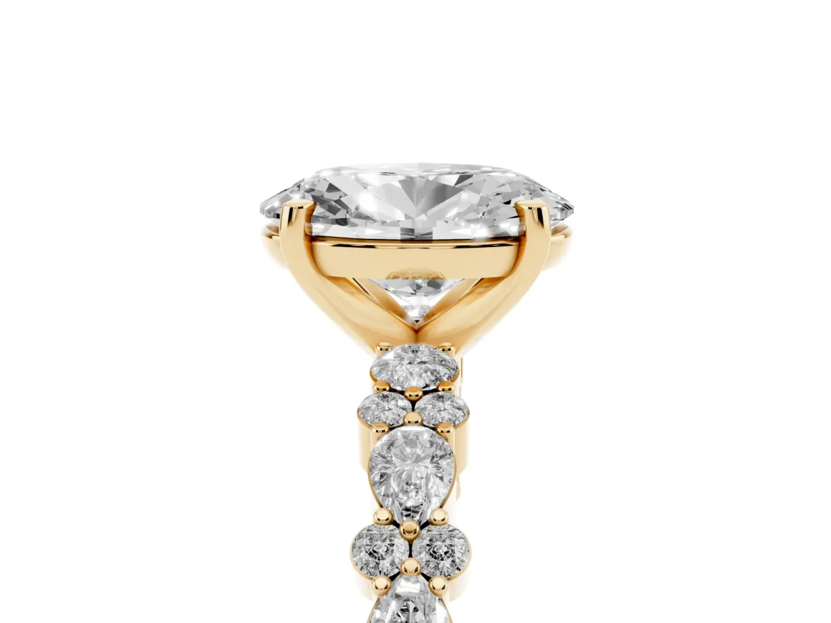 Oval Cut Diamond Side Stone Solitaire Ring with Round and Four-Prong Setting Yellow gold