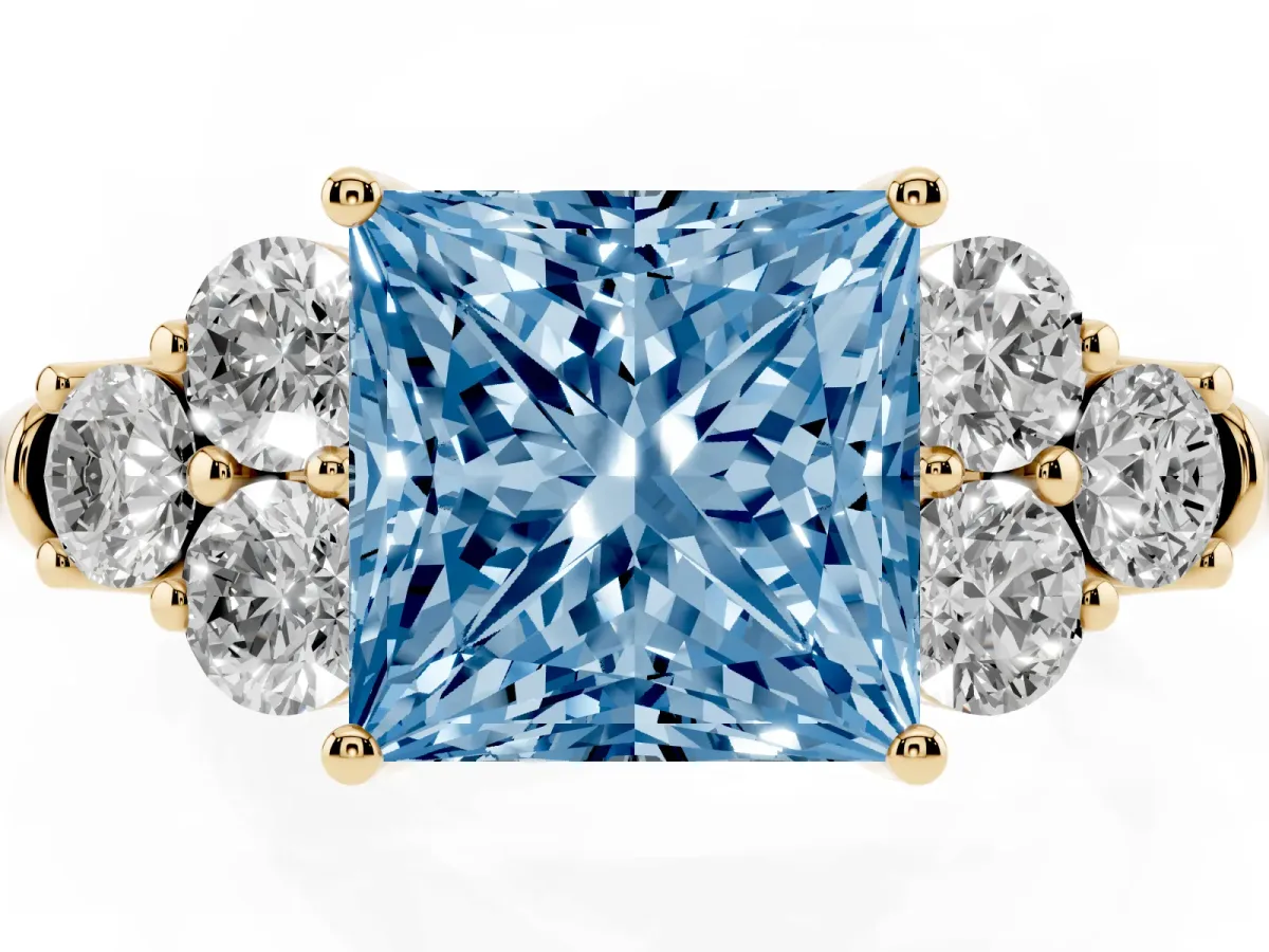 Fancy Blue Princess Cut Cut Diamond Cluster Ring with Round Accent Stones and Prong Setting on a Classic Band Yellow gold