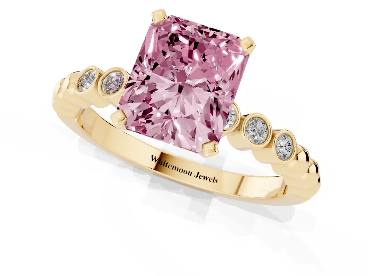 Fancy Pink Radiant Cut Solitaire Bezel Accent Diamond Engagement Ring with Beaded Band and Four-Prong Setting Yellow gold