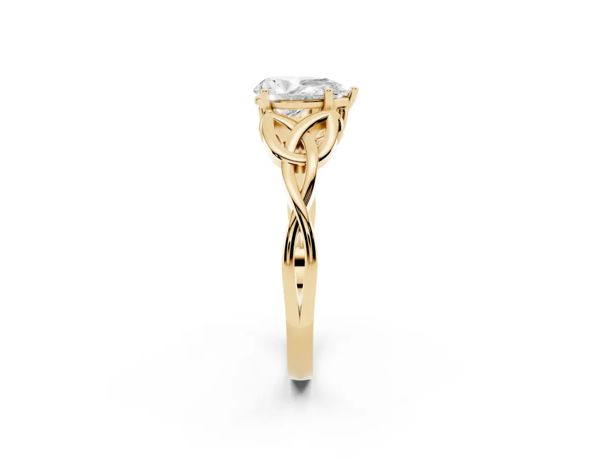 Pear Cut Diamond Solitaire Engagement Ring with Celtic Knot Band and Four-Prong Setting Yellow gold