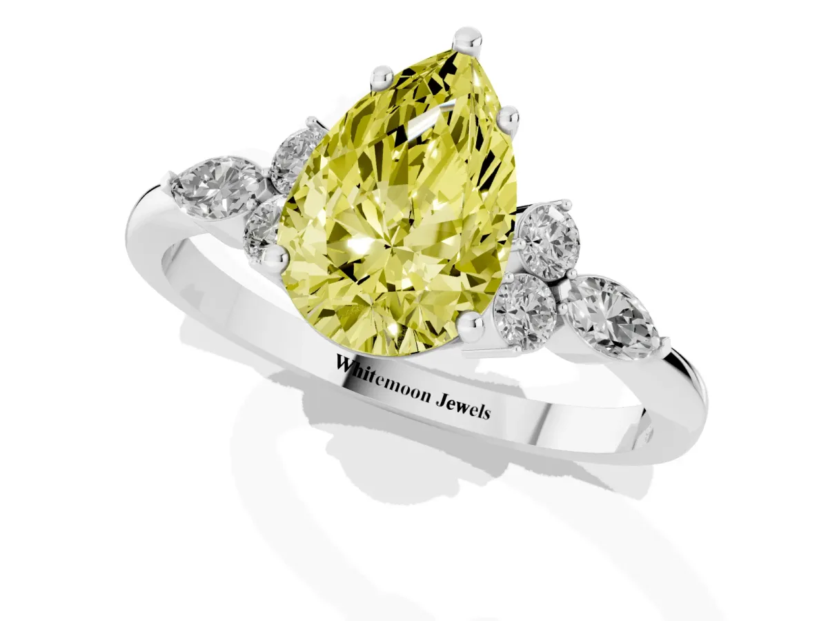 Fancy Yellow Pear Cut Brilliant Diamond Solitaire Ring with Pear Side Stones and Four-Prong Setting Silver