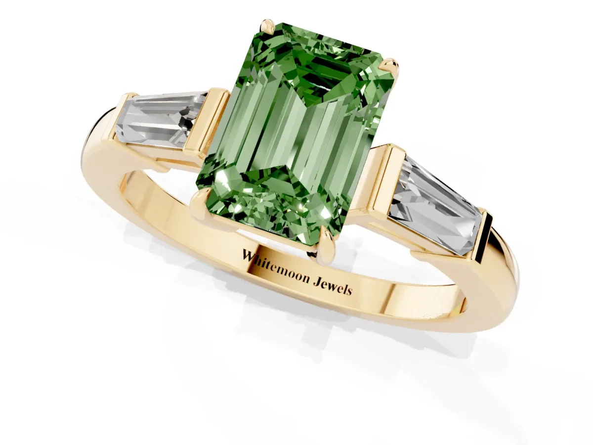 Fancy Green Emerald Cut Diamond Three-Stone Ring with Tapered Baguette Side Stones and Prong Setting Yellow gold