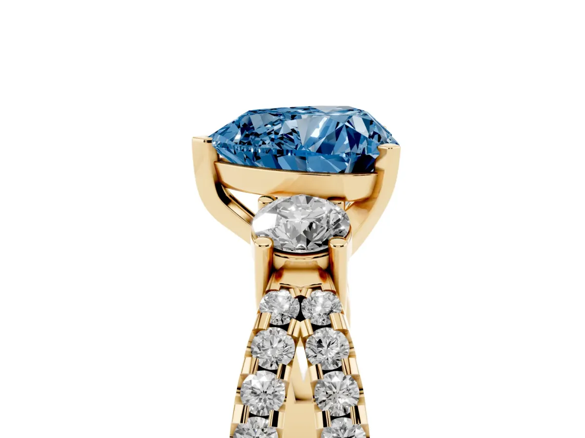 Fancy Blue Heart Cut Diamond Three-Stone Ring with Pavé Split Shank and Four-Prong Setting Yellow gold