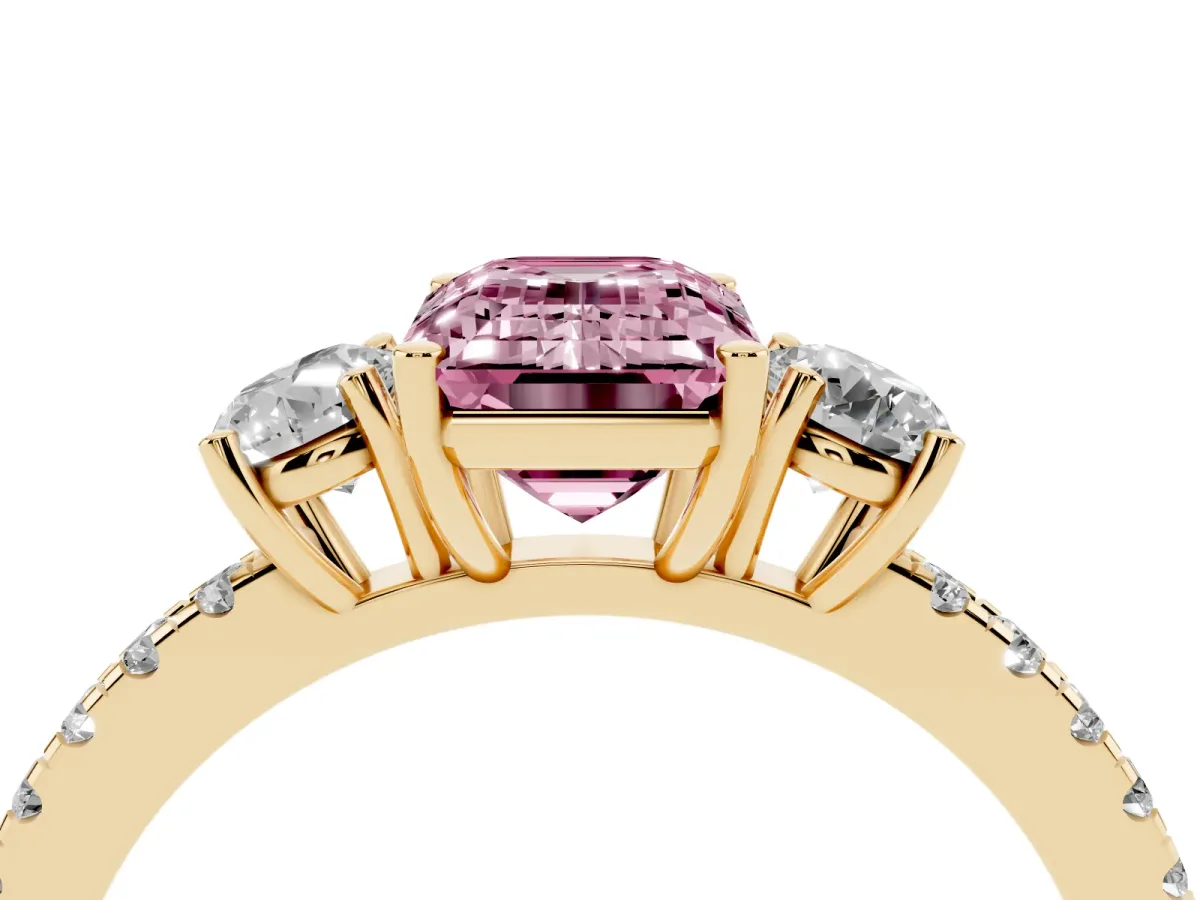 Fancy Pink Three-Stone Emerald Cut Cut Diamond Pavé Band with Prong Setting Yellow gold