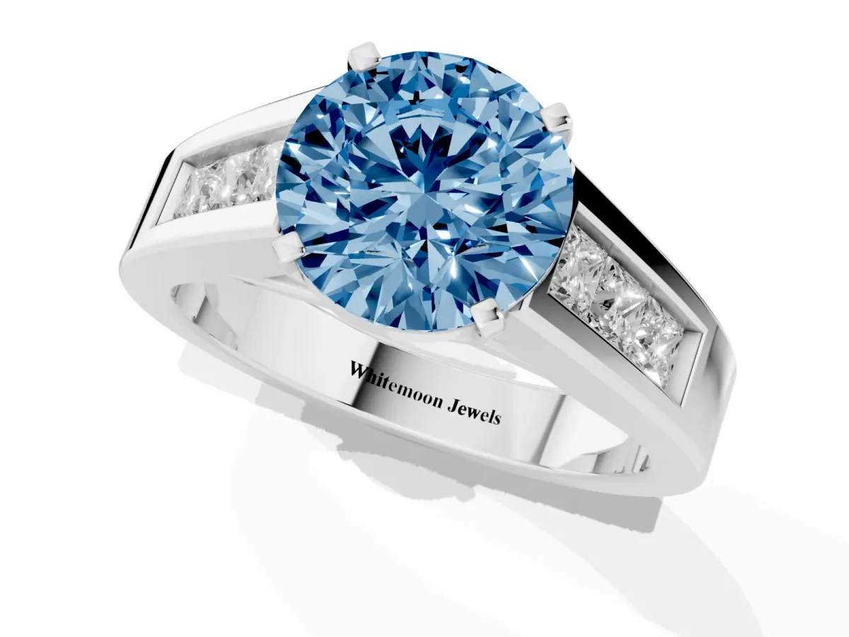 Fancy Blue Round Cut Cut Channel Set Solitaire Ring with Four-Prong Setting Silver