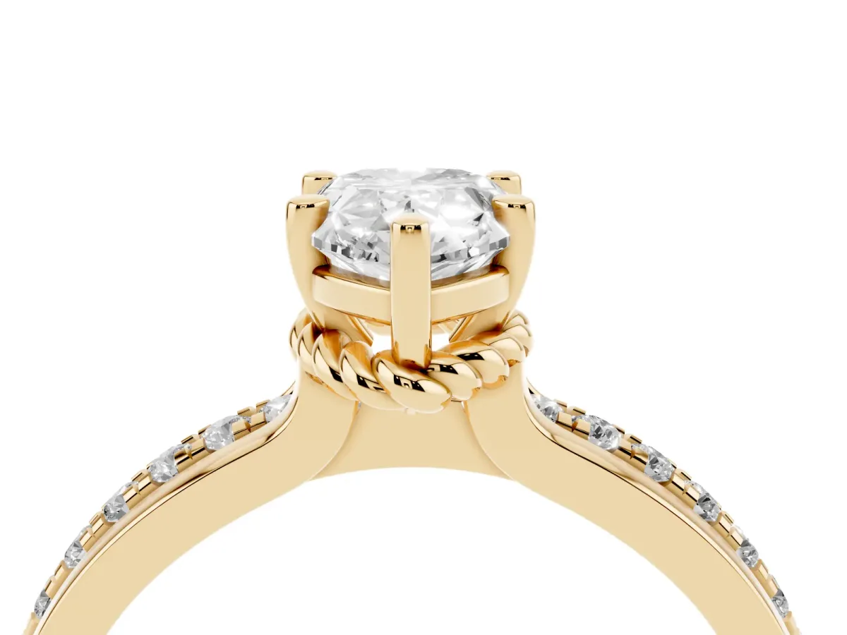 Pear Cut Solitaire Diamond Ring with Channel Set Band and Six-Prong Setting Yellow gold