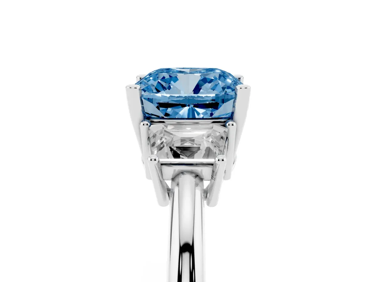 Fancy Blue Cushion Cut Diamond Three-Stone Ring with Trapezoid Side Stones and Prong Setting Platinum
