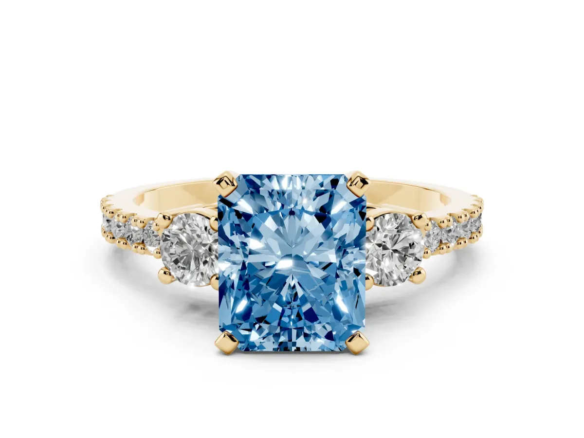 Fancy Blue Radiant Cut Three-Stone Diamond Pavé Band with Prong Setting Yellow gold
