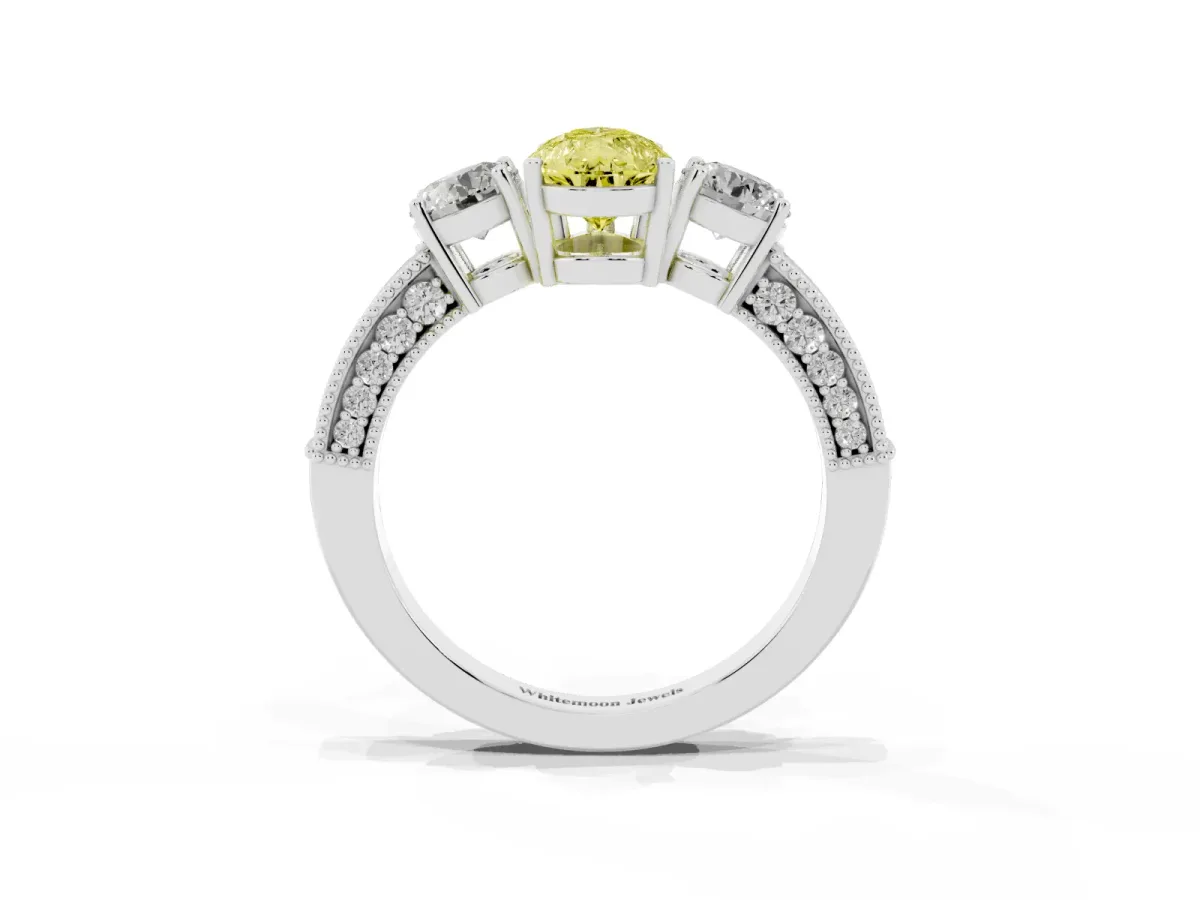 Fancy Yellow Pear Cut Three-Stone Diamond Ring with Pavé Band and Four-Prong Setting Silver