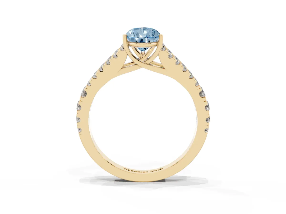 Fancy Blue Pear Cut Diamond Split Shank Engagement Ring with Round Pavé and Prong Setting Yellow gold