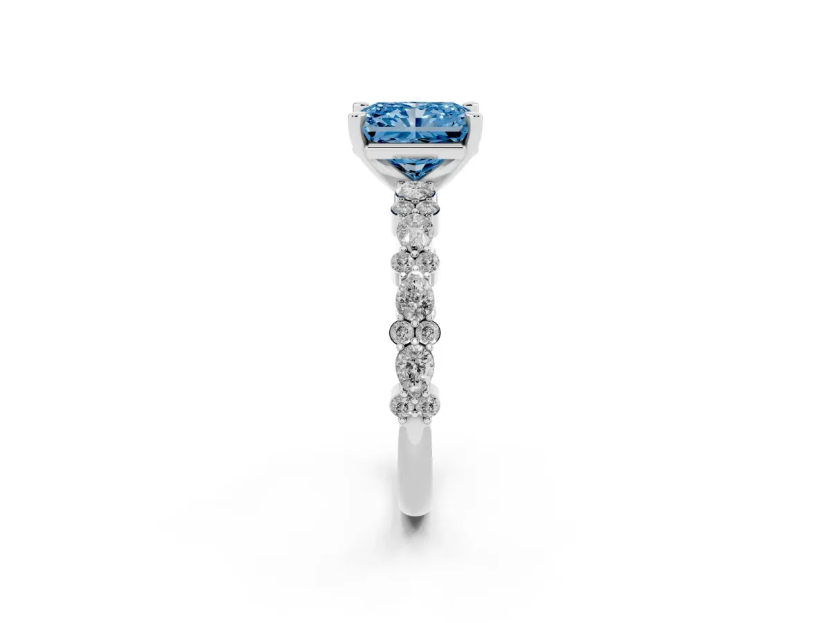 Fancy Blue Radiant Cut Diamond Side Stone Solitaire Ring with Round and Four-Prong Setting Platinum