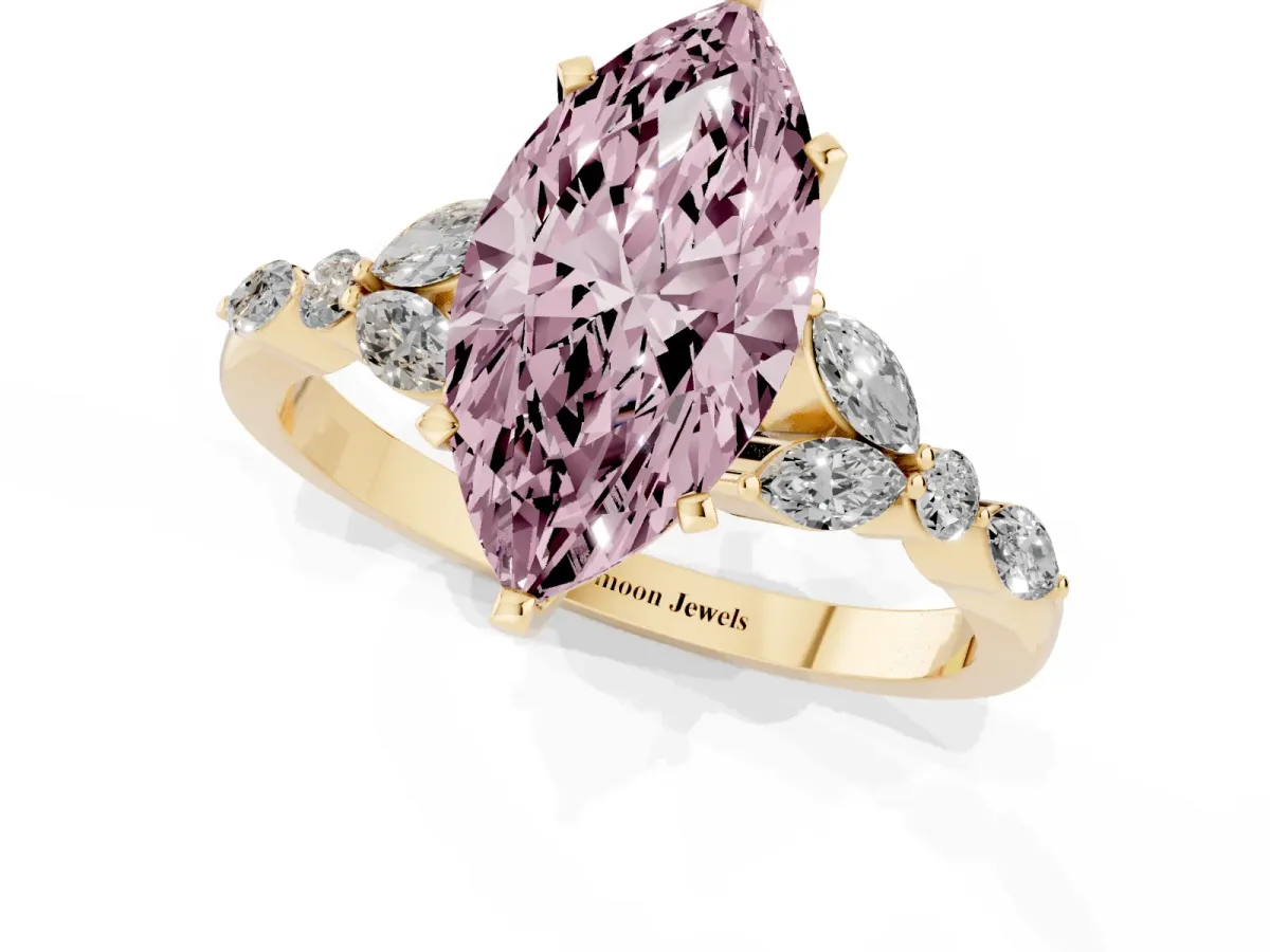 Fancy Pink Marquise Cut Diamond Solitaire Ring with Side Stones and Four-Prong Setting Yellow gold