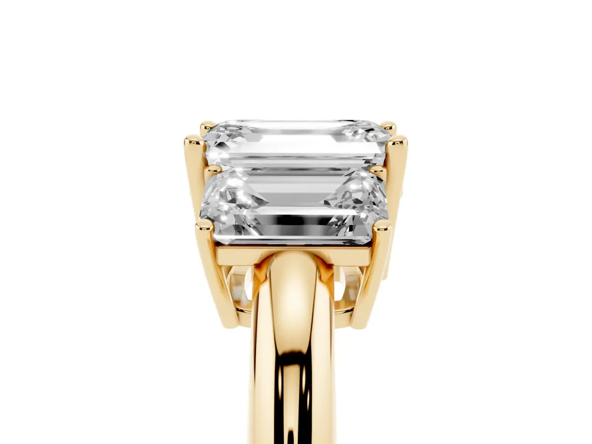 Three-Stone Emerald Cut Cut Diamond Engagement Ring with Prong Setting on a White Gold Band Yellow gold