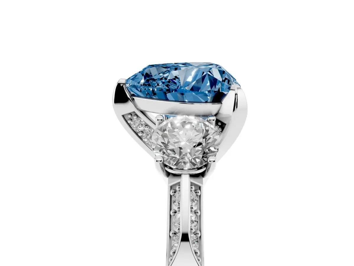 Fancy Blue Heart Cut Brilliant Three-Stone Diamond Ring with Pavé Band and Four-Prong Setting Platinum