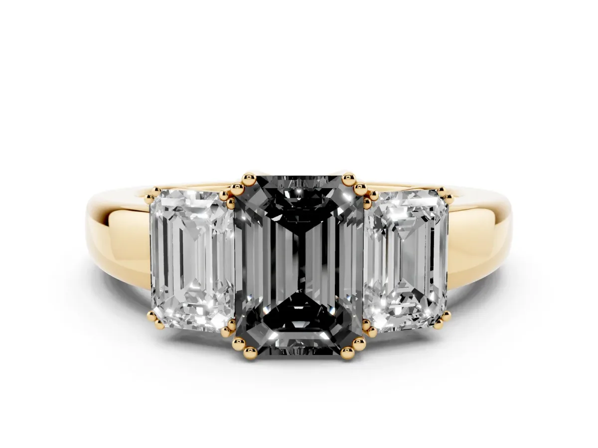 Fancy Black Three-Stone Emerald Cut Cut Diamond Ring with Channel Set Band and Four-Prong Setting Yellow gold