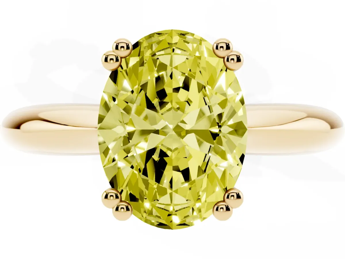 Fancy Yellow Oval Cut Cut Solitaire Engagement Ring with Tapered Band and Four-Prong Setting Yellow gold