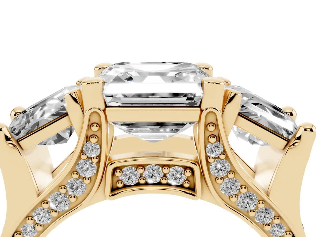 Asscher Cut Diamond Three-Stone Ring with Channel Set Band and Four-Prong Setting Yellow gold