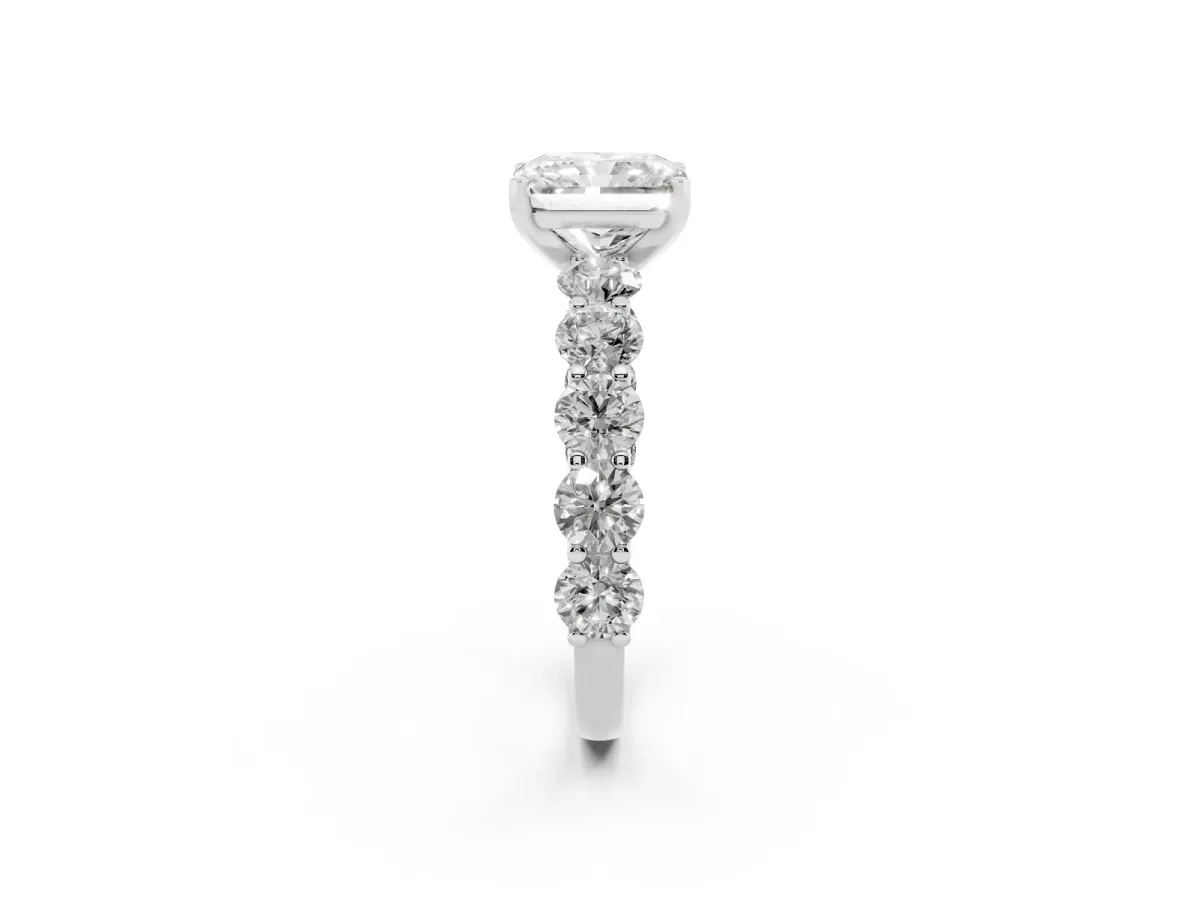 Radiant Cut Diamond Prong Setting with Side Stones on a Pave Band Silver