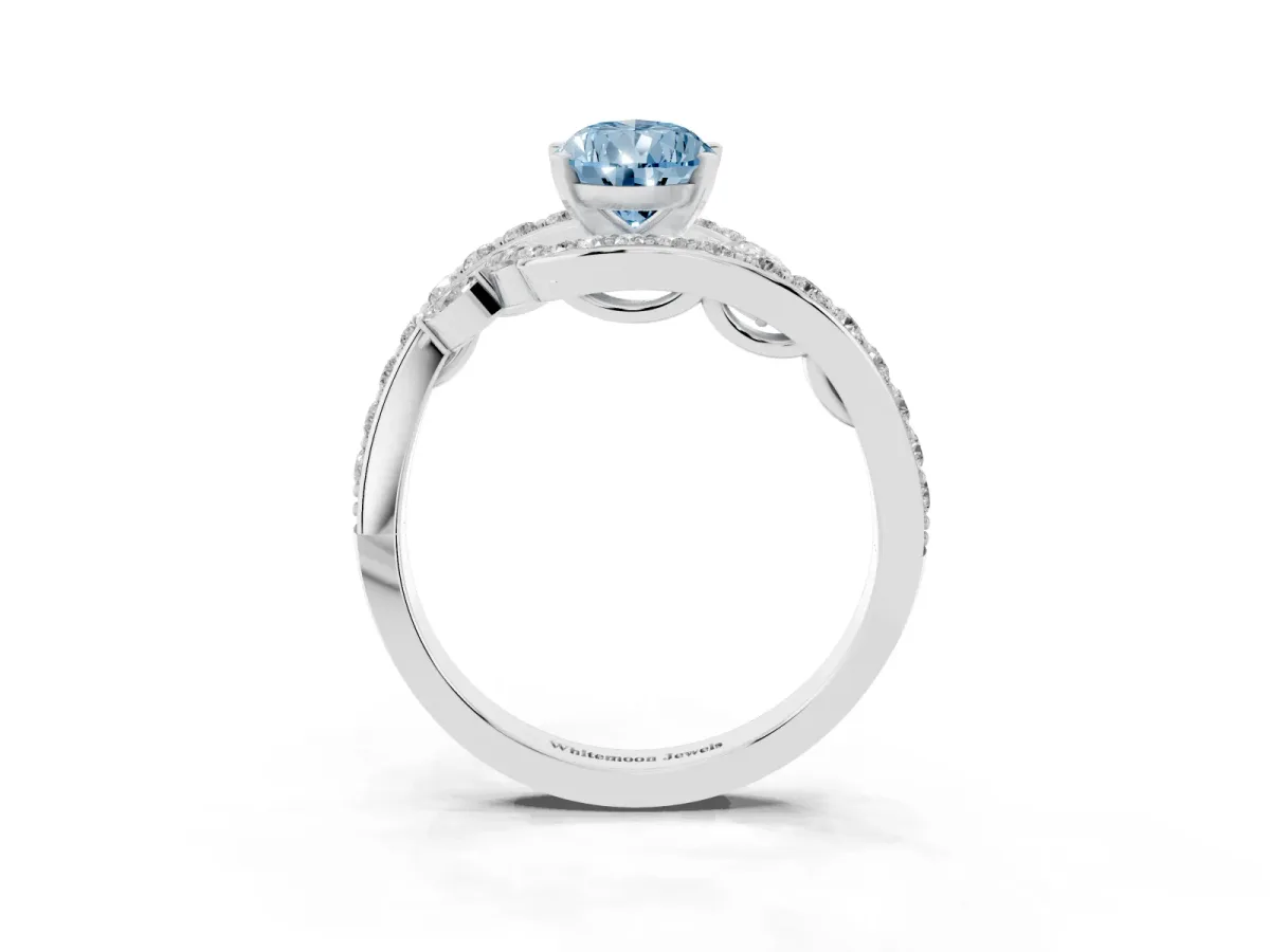 Fancy Blue Pear Cut Solitaire with Pavé Twist Band and Four-Prong Setting Silver