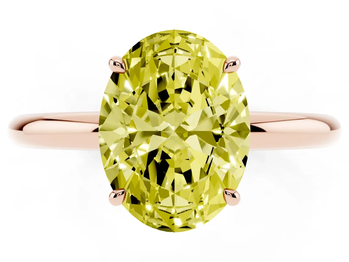 Fancy Yellow Oval Cut Diamond Solitaire Ring with Thin Band and Four-Prong Setting Rose gold