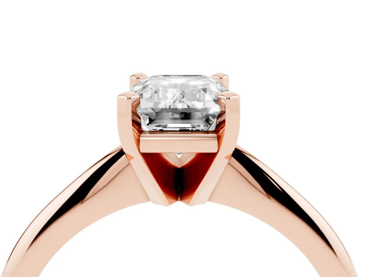 Emerald Cut Cut Solitaire Ring with Four-Prong Setting on a Classic Band Rose gold