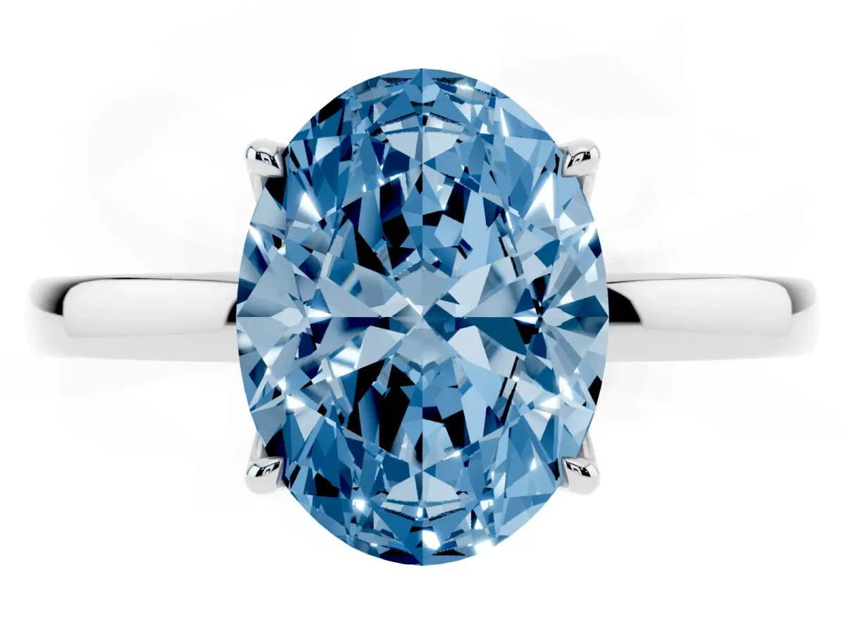 Fancy Blue Oval Cut Diamond Solitaire Ring with Thin Band and Prong Setting Silver