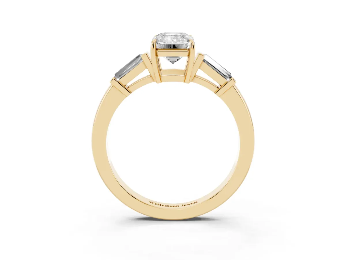 Emerald Cut Diamond Three-Stone Ring with Tapered Baguette Side Stones and Prong Setting Yellow gold
