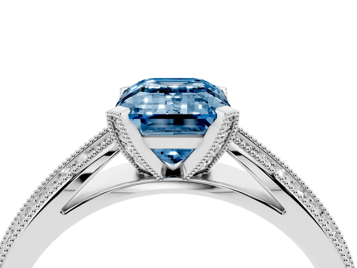 Fancy Blue Emerald Cut Diamond Solitaire Ring with Milgrain Round Pavé Band and Prong Setting Silver