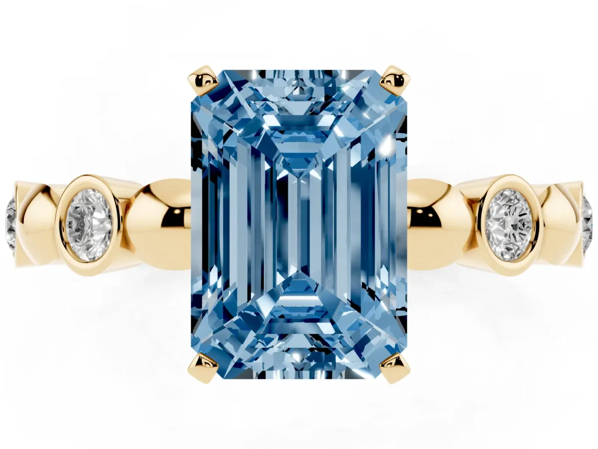 Fancy Blue Emerald Cut Solitaire Bezel-Set Diamond Ring with Beaded Band and Four-Prong Setting Yellow gold