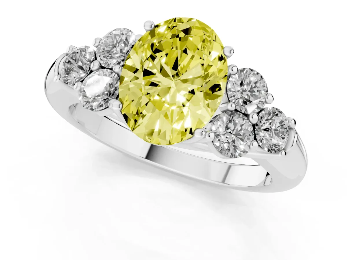 Fancy Yellow Oval Cut Cut Diamond Cluster Ring with Round Accent Stones and Prong Setting on a Classic Band Platinum