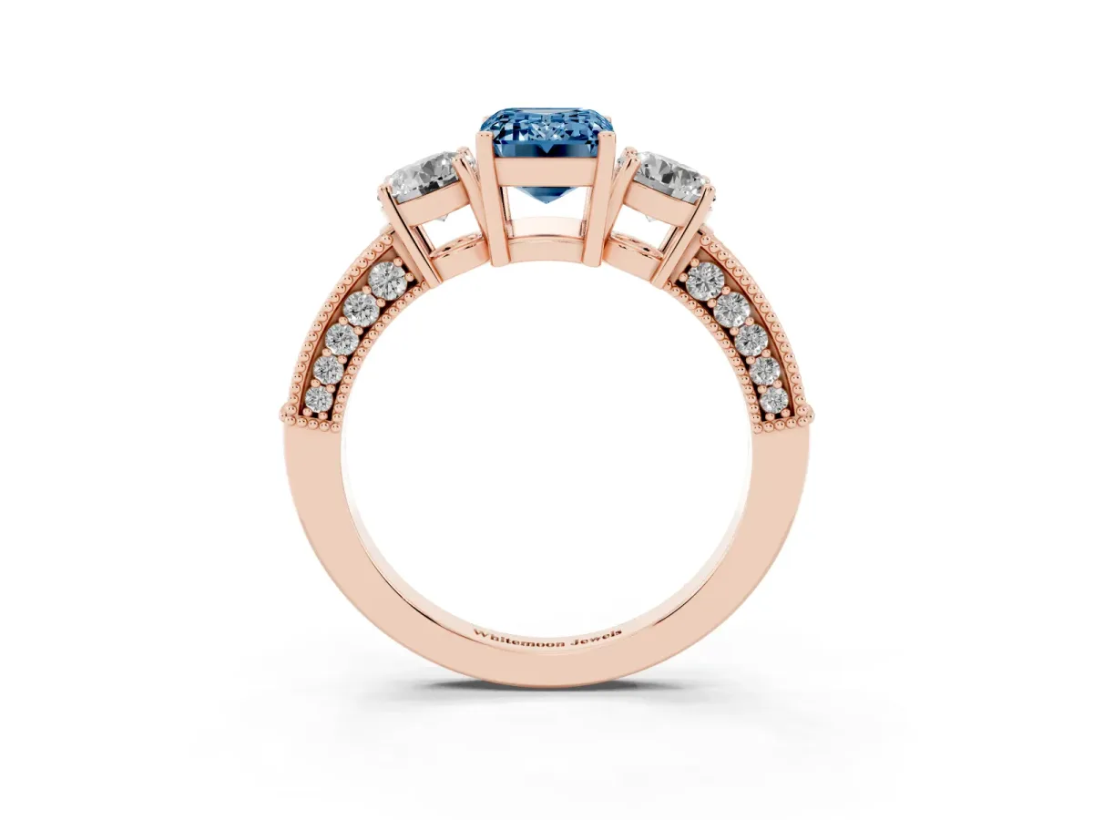 Fancy Blue Emerald Cut Three-Stone Diamond Ring with Pavé Band and Four-Prong Setting Rose gold