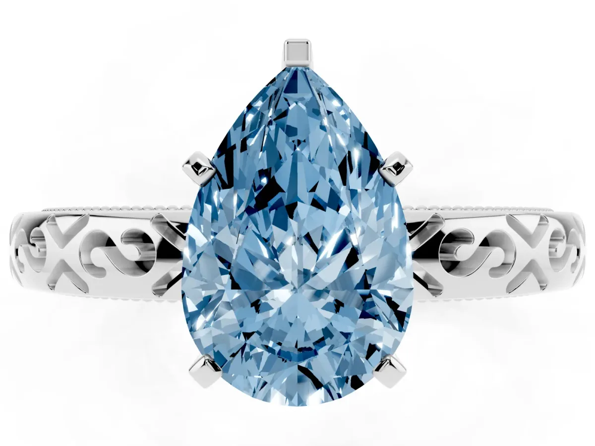 Fancy Blue Pear Cut Solitaire Engagement Ring with Scrollwork Band and Four-Prong Setting Silver