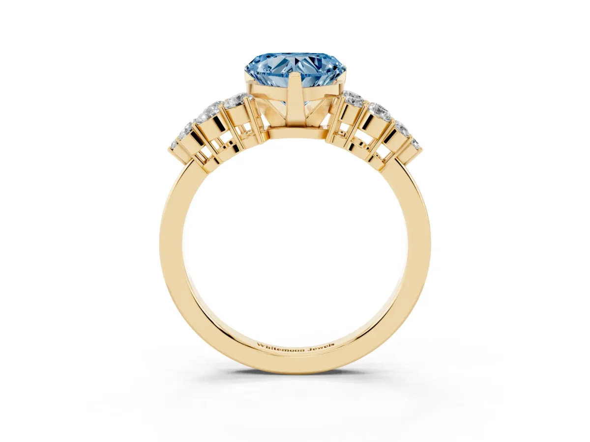 Fancy Blue Heart Cut Cluster Diamond Engagement Ring with Pavé Band and Four-Prong Setting Yellow gold