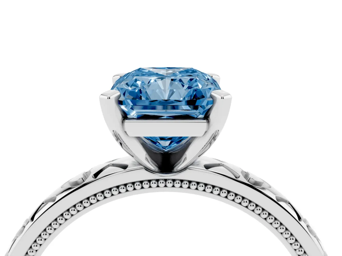 Fancy Blue Radiant Cut Solitaire Diamond Engagement Ring with XO Engraved Band and Four-Prong Setting Silver