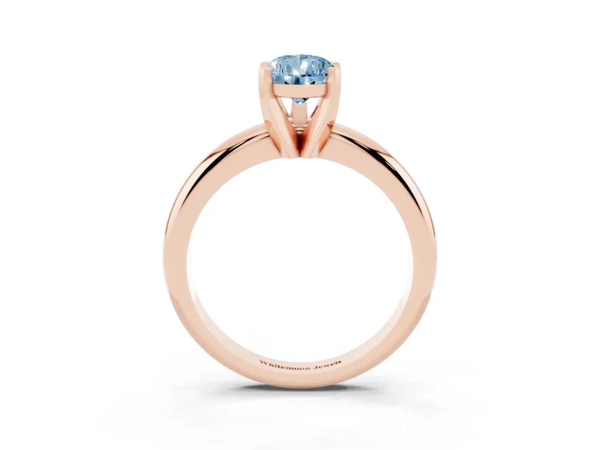 Fancy Blue Pear Cut Diamond Solitaire Engagement Ring with Round Band and Four-Prong Setting Rose gold