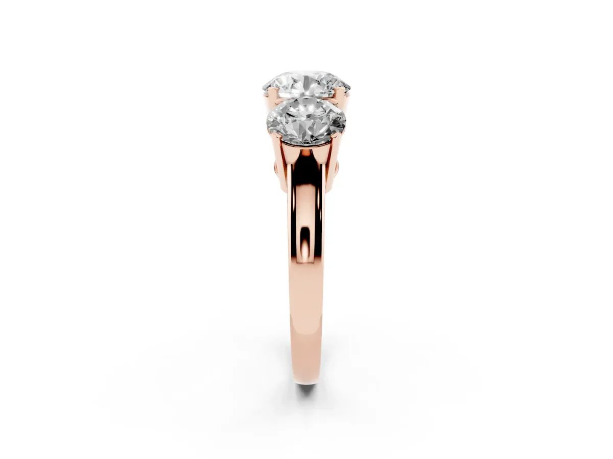 Three-Stone Round Cut Cut Diamond Ring with Channel Set Band and Four-Prong Setting Rose gold