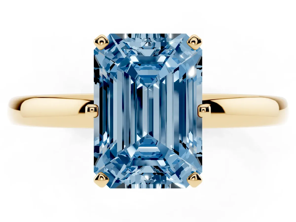 Fancy Blue Emerald Cut Solitaire Diamond Ring with Six-Prong Setting on a Classic Band Yellow gold