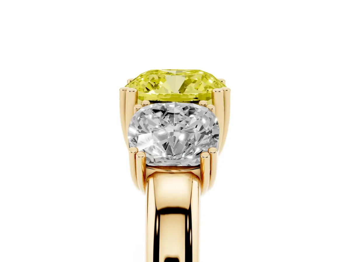 Fancy Yellow Three-Stone Cushion Cut Cut Diamond Ring with Channel Set Band and Four-Prong Setting Yellow gold