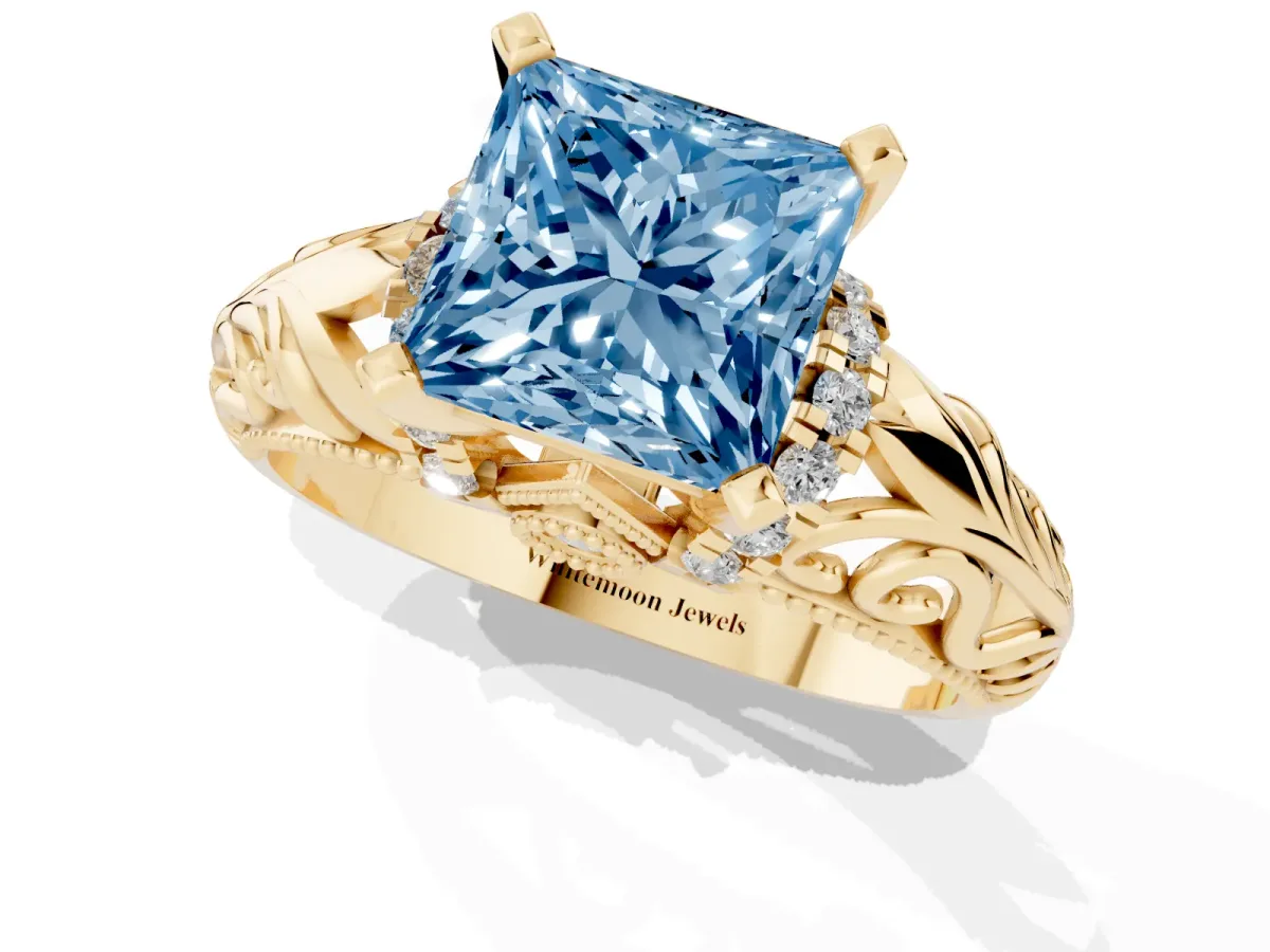 Fancy Blue Princess Cut Solitaire Filigree Engagement Ring with Halo and Prong Setting Yellow gold