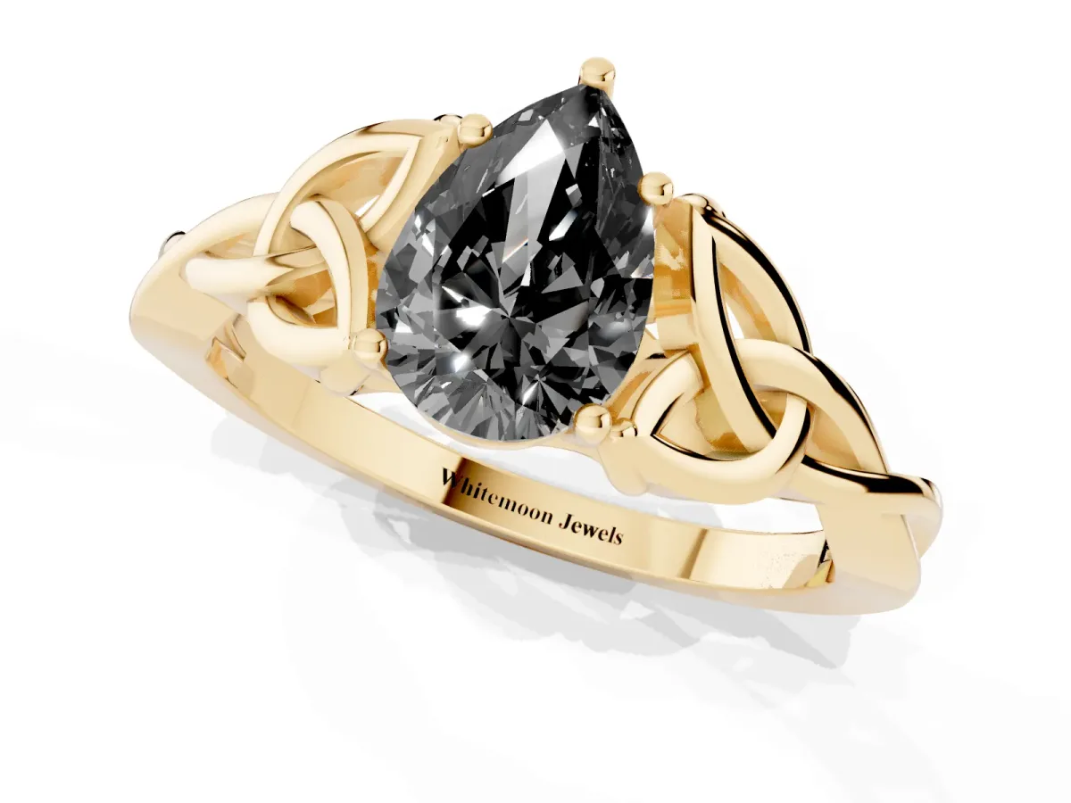 Fancy Black Pear Cut Diamond Solitaire Engagement Ring with Celtic Knot Band and Four-Prong Setting Yellow gold