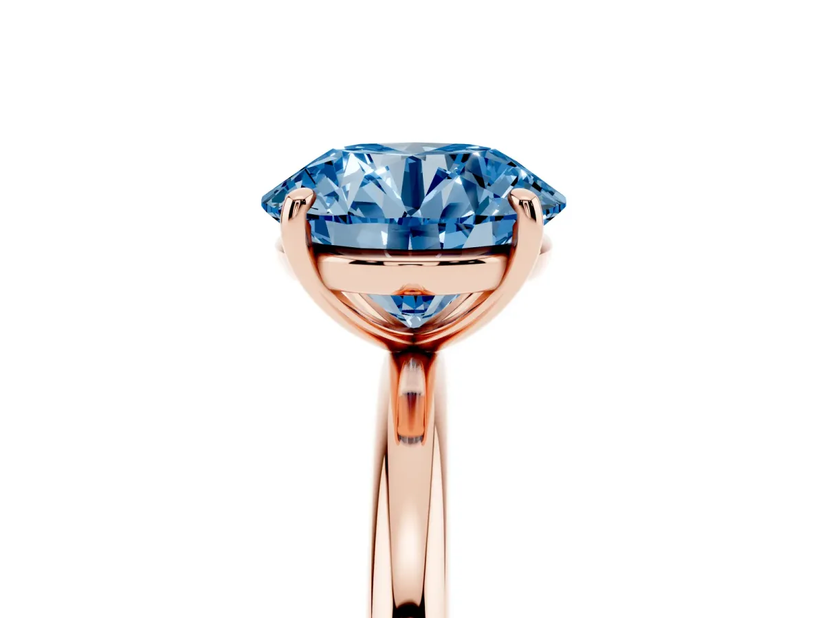 Fancy Blue Round Cut Solitaire Diamond Ring with Four-Prong Setting on a Plain Band Rose gold