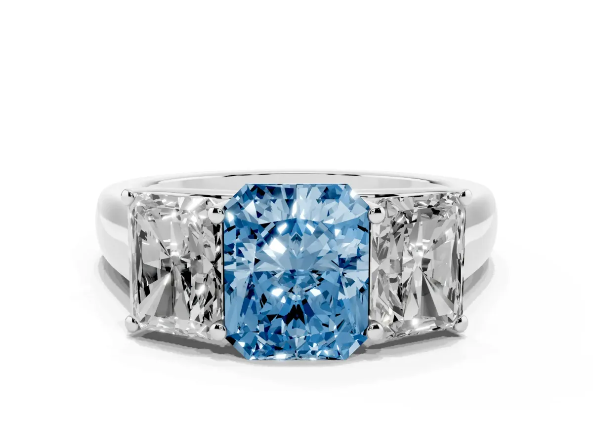 Fancy Blue Radiant Cut Three-Stone Diamond Ring with Prong Setting on a Classic Band Platinum