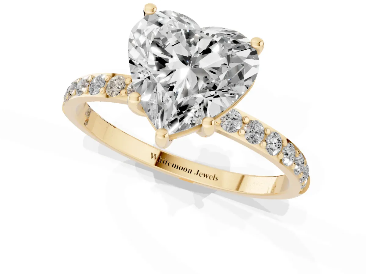 Heart Cut Diamond Solitaire Ring with Round Pavé Shoulders and Prong Setting Yellow gold