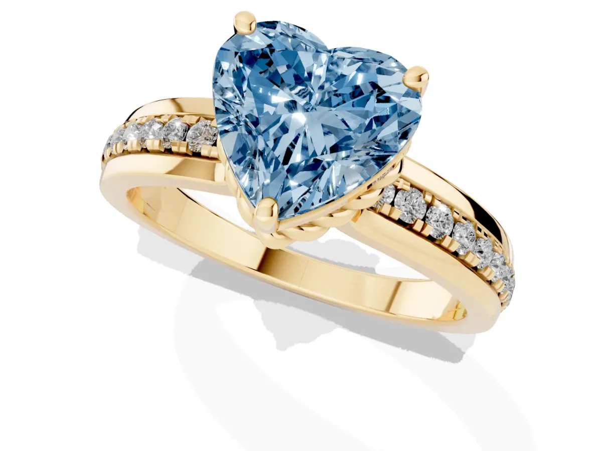 Fancy Blue Heart Cut Solitaire Diamond Ring with Channel Set Band and Six-Prong Setting Yellow gold