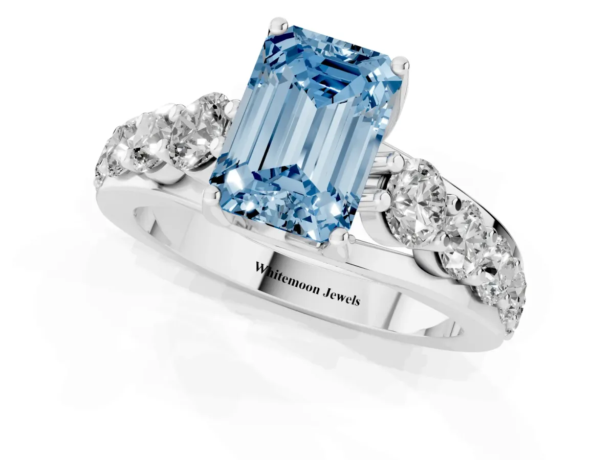 Fancy Blue Emerald Cut Diamond Engagement Ring with Pavé Band and Four-Prong Setting Silver