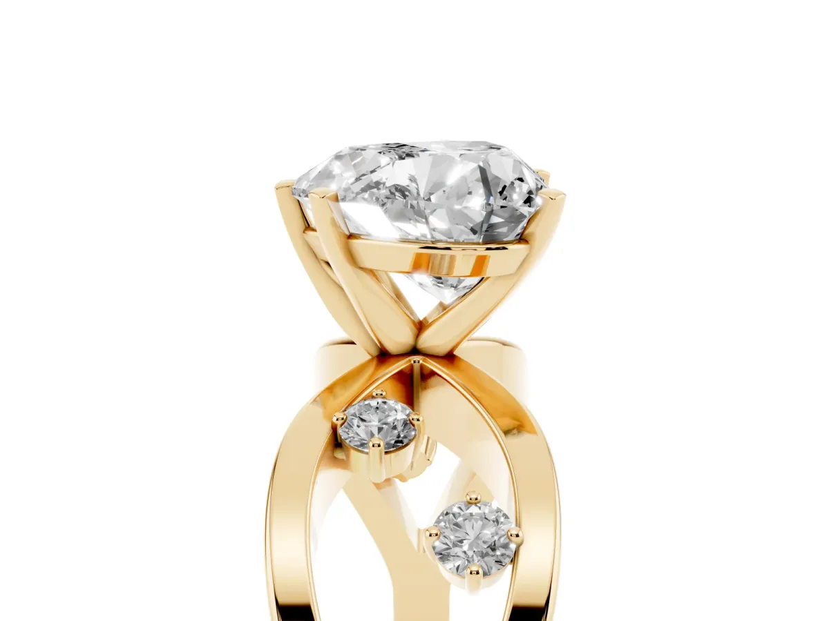 Heart Cut Cut Solitaire Diamond with Side Stones on Criss-Cross Band and Four-Prong Setting Yellow gold