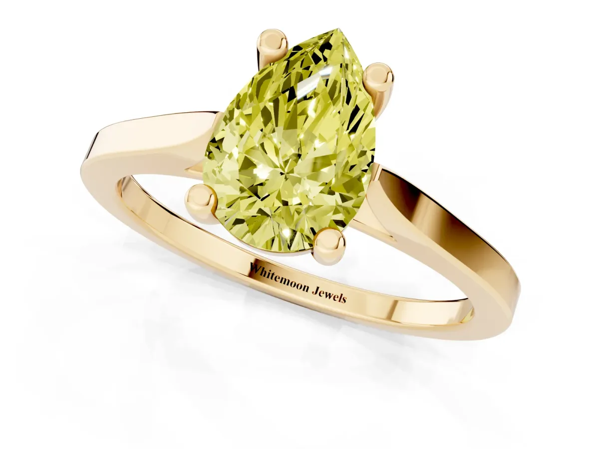 Fancy Yellow Pear Cut Solitaire Diamond Ring with Four-Prong Setting and Tapered Band Yellow gold