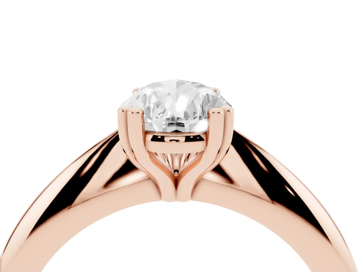 Pear Cut Cut Solitaire Engagement Ring with Tapered Band and Four-Prong Setting Rose gold