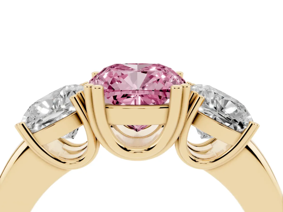 Fancy Pink Three-Stone Cushion Cut Cut Diamond Ring with Channel Set Band and Four-Prong Setting Yellow gold