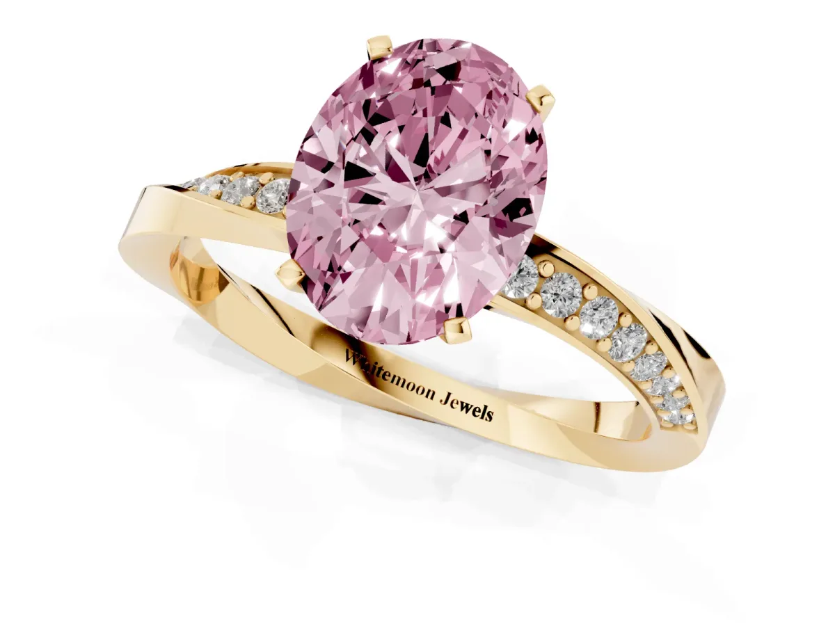 Fancy Pink Oval Cut Diamond Engagement Ring with Side Stone Accents and Four-Prong Setting Yellow gold
